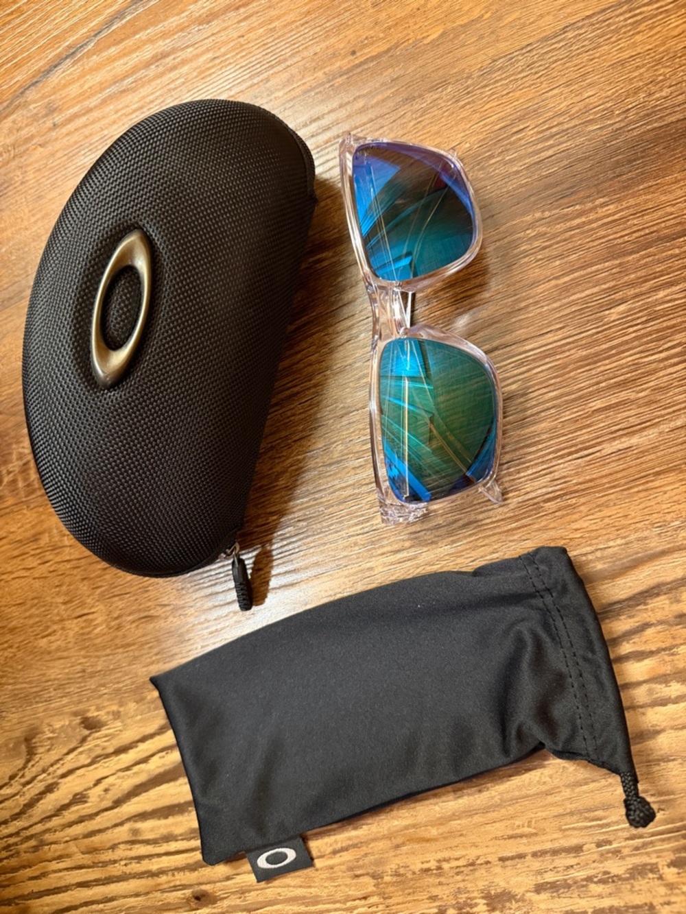 Oakley Clear Frame Sunglasses with Blue-Green Mirrored Lenses